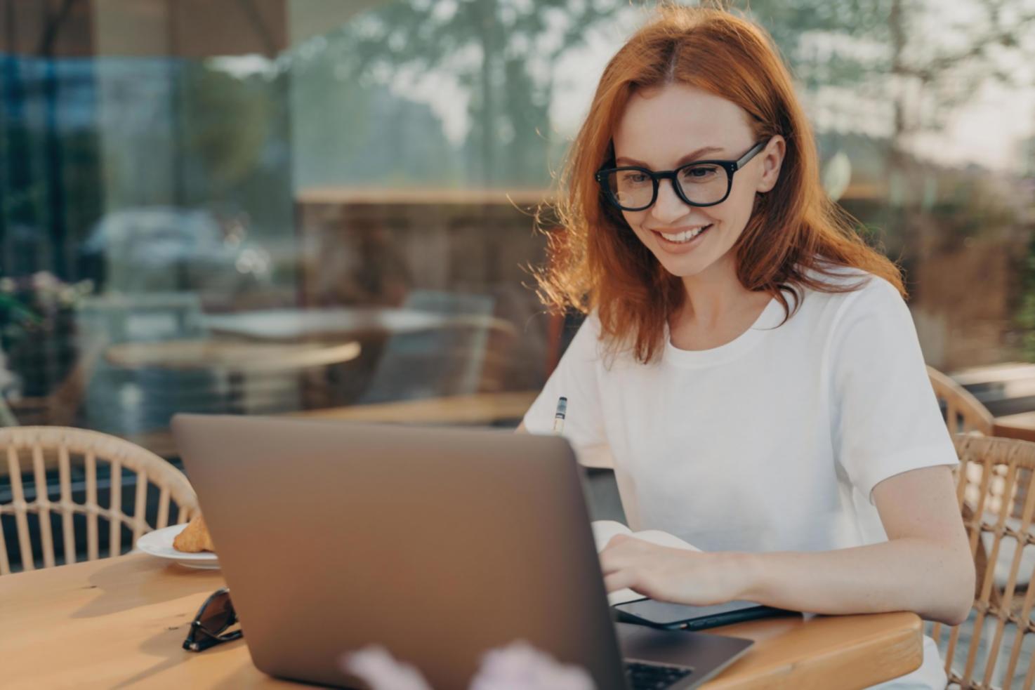 Business owner working with financial planning materials in modern office space
